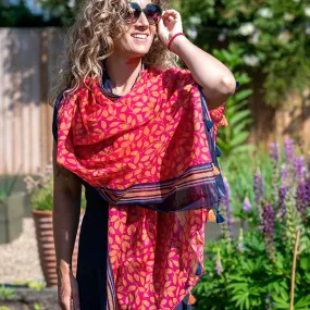 Red and orange leaf print cotton scarf with stripes and tassels
